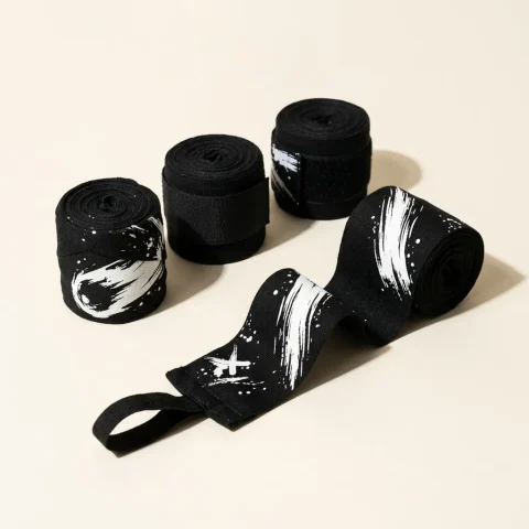 Comet Brushstroke Hand Wraps: two pairs, rolled, the ink strokes still in pieces