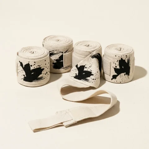 Round Brushstroke Hand Wraps: two pairs, rolled, the ink strokes still in pieces